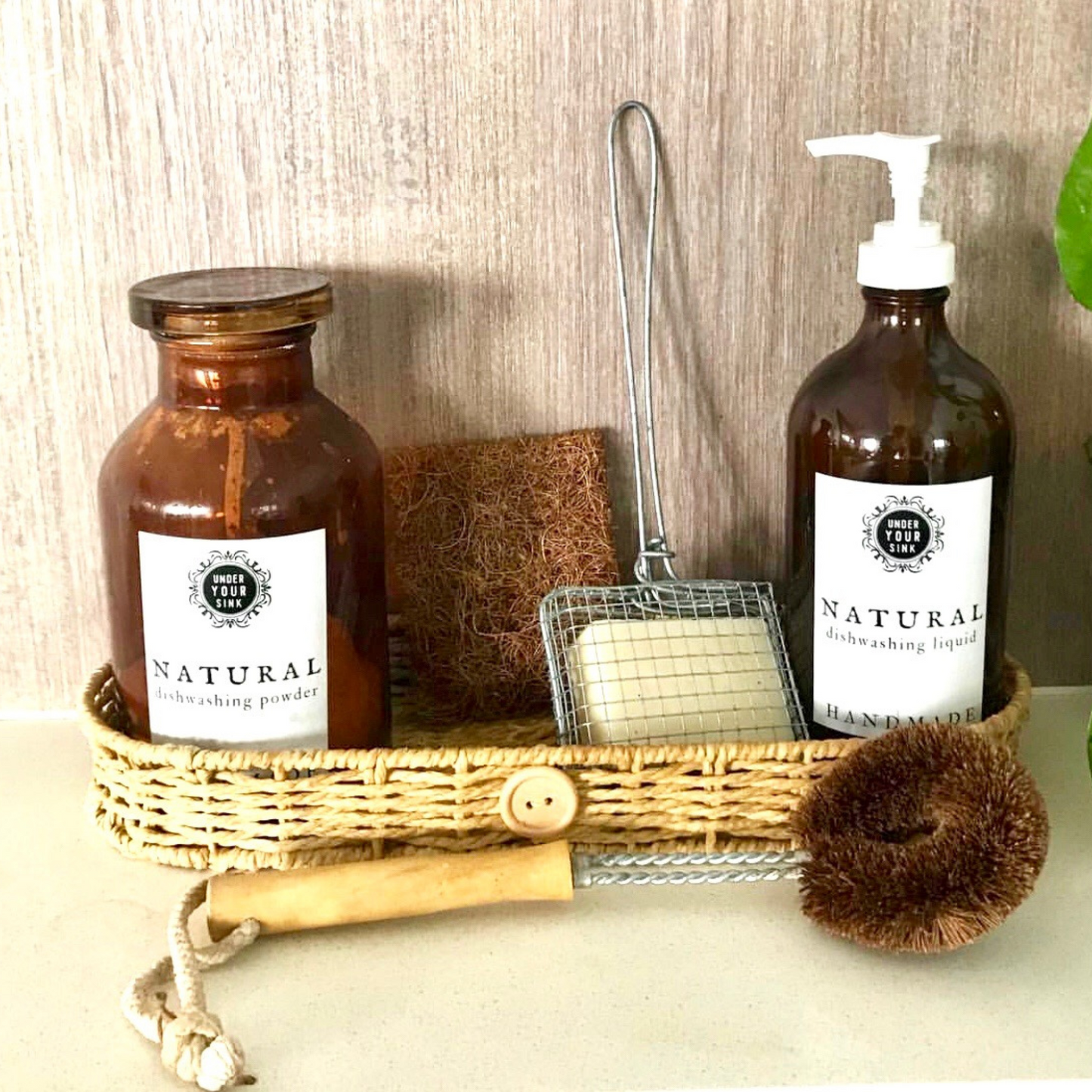 Amber glass pump bottle and amber glass vintage look apothecary jar set up for kitchen green cleaning and zero waste. Supplies available at under your sink online Australia.