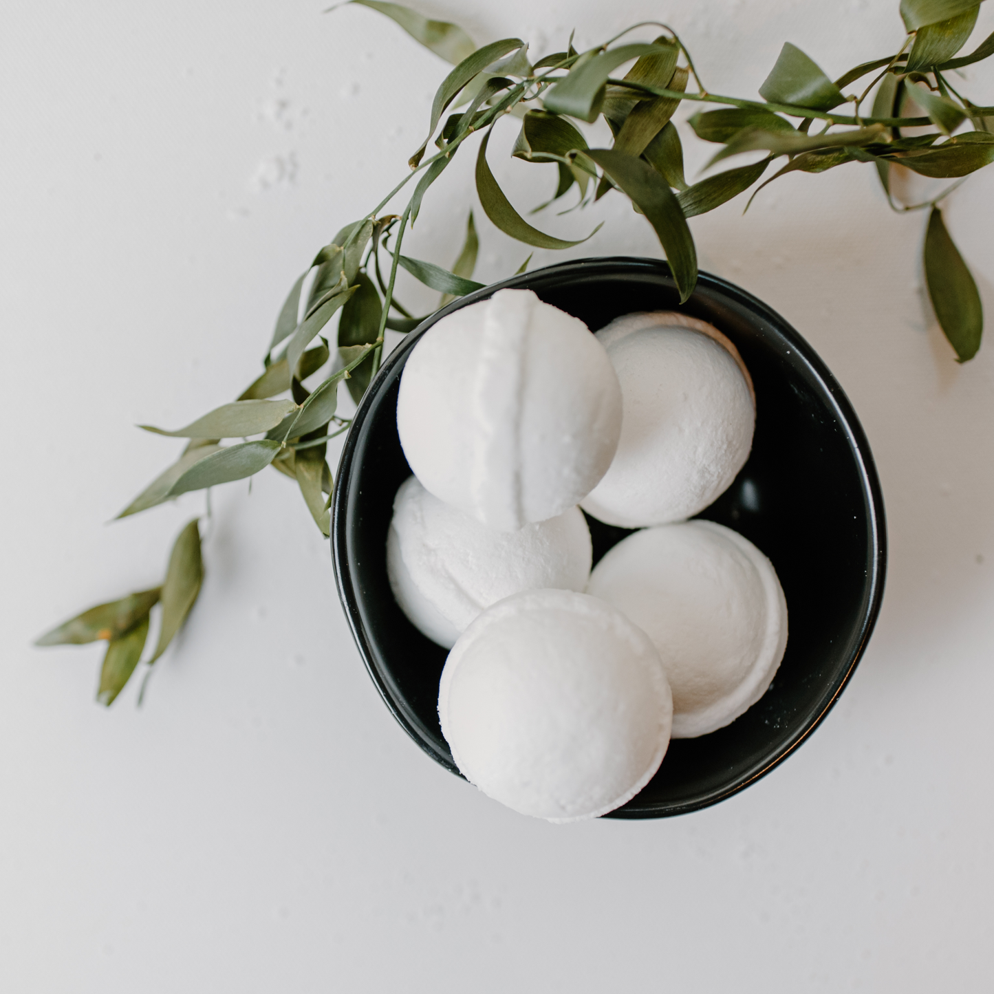 A bowl with white bath bombs made from citric acid and bicarb soda