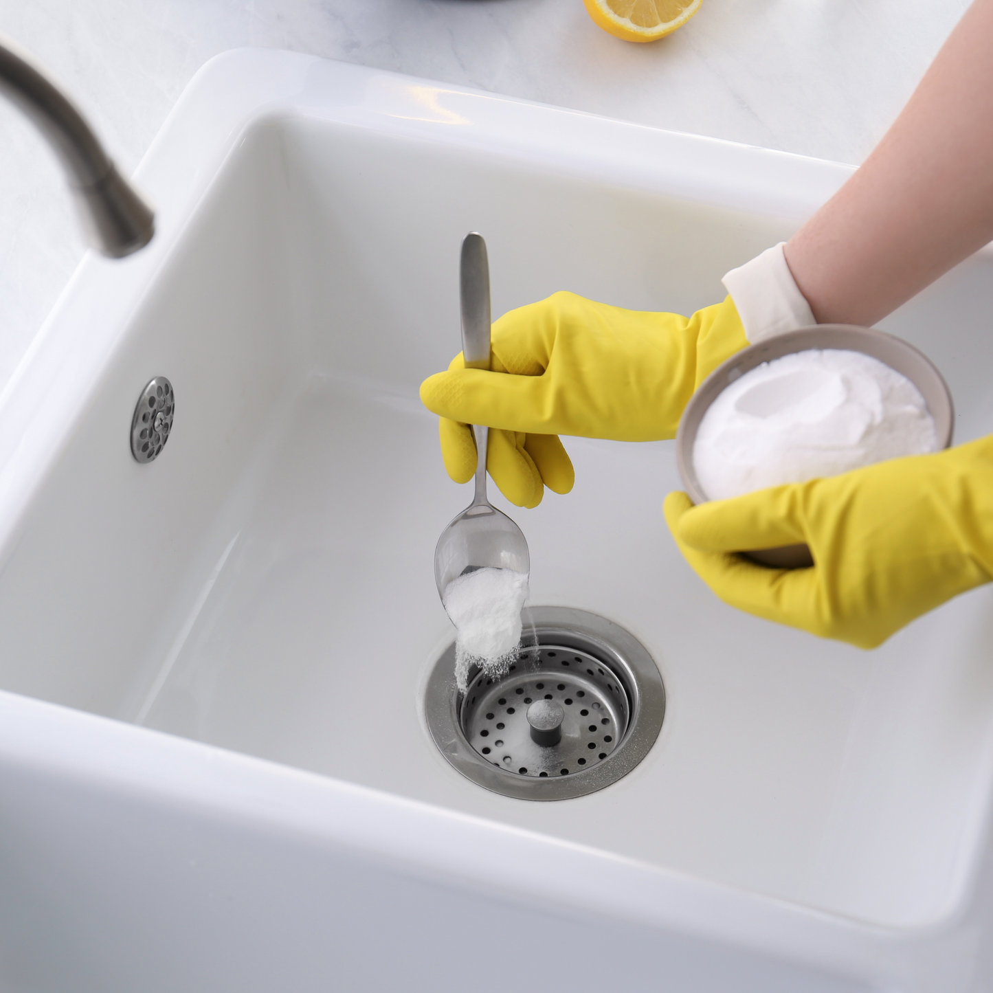Washing Soda (sodium carbonate) being poured into sink for drain cleaner