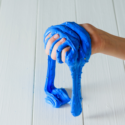 Homemade slime for kids that is blue and squishy made with Borax