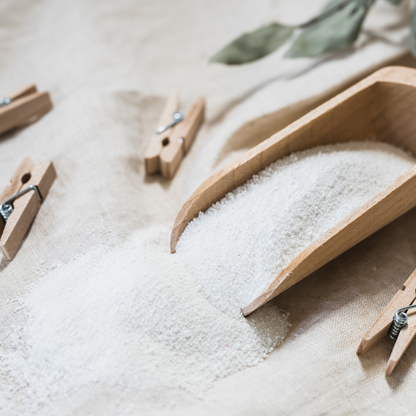Borax laundry booster for handmade laundry powder. Borax powder in a scoop with pegs