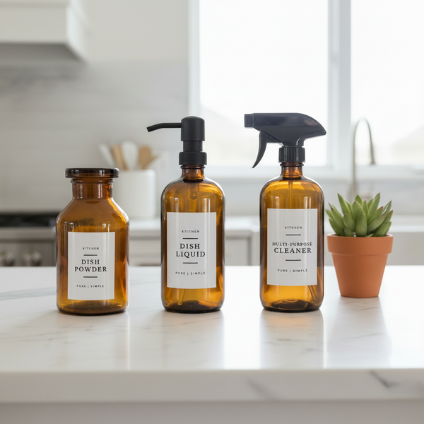 Three bottles of kitchen cleaning products with labels on a white background